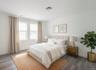 Virtually staged. Bedroom with two windows, recessed lighting and wood-look flooring.