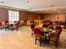 Over sized party room with fireplace, piano and lounge chair available can be rented/reserved