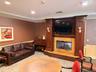 Over sized party room with fireplace, piano and lounge chairs available can be rented/reserved