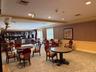 Over sized party room with fireplace, piano and lounge chairs available can be rented/reserved