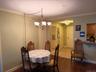 Dining Room just off the kitchen as shown. Plenty of room for a larger table and additional seating can be placed at the nook facing the window cutout