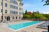 Outdoor swimming pool with integrated entry steps and surrounding deck