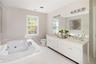 Large soaking tub, double vanity, & separate shower out of view