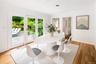 Shows door to laundry room, back entry in hall, access to garage, bedroom en-suite,