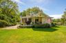 Covered porch with access from both dinning room and four seasons room. the perfect place to start or end the day