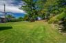 Yard with plenty of room for the family to play on this pesticide free lawn