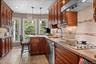 Kitchen with eat in counter  and view of yard