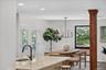 Kitchen island with a built-in sink and a gooseneck faucet