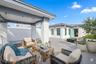Rooftop with staged furniture for perspective.