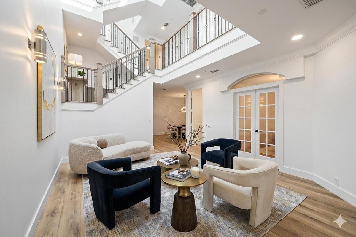 Entrance area with staged furniture for perspective.