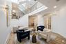 Entrance area with staged furniture for perspective.