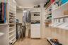 PRIMARY BEDROOM WALK IN CUSTOM CLOSET
