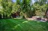 Private, flat backyard with separate firepit area