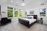 Primary with high, vaulted ceilings and exceptional light