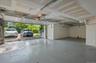 Large two car garage with overflow storage and EV port