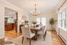 Formal Dinning Room w/ French Doors Out To Backyard - Enhanced Photo