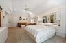 Primary Bedroom With Vaulted Ceiling, Natural Light and Oversized Walk-in Closet