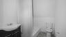 Bathroom with a tub to relax in, toilet, and vanity