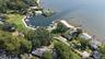 Aerial view of the marina, boat dock, and beach