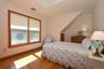 Upper level bedroom with waterviews