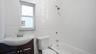 Full bathroom featuring vanity, toilet, and tiled shower / bath combo