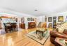 Light wood-finish flooring, white walls, and a multi-level floor plan with visible stairs