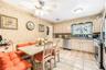 Kitchen featuring light-toned cabinetry, tile flooring, and stainless steel appliances
