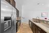Gourmet kitchen with granite countertops and breakfast bar.