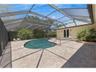 The large free form heated pool is completely screened in