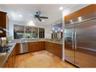 The large chef's kitchen has high end appliances, a gas cooktop, and a double wall oven