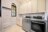 Expansive Laundry Suite with sink and ample storage