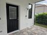 Pool door from primary bath with outdoor shower