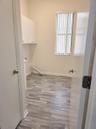 Laundry room with sink and closet