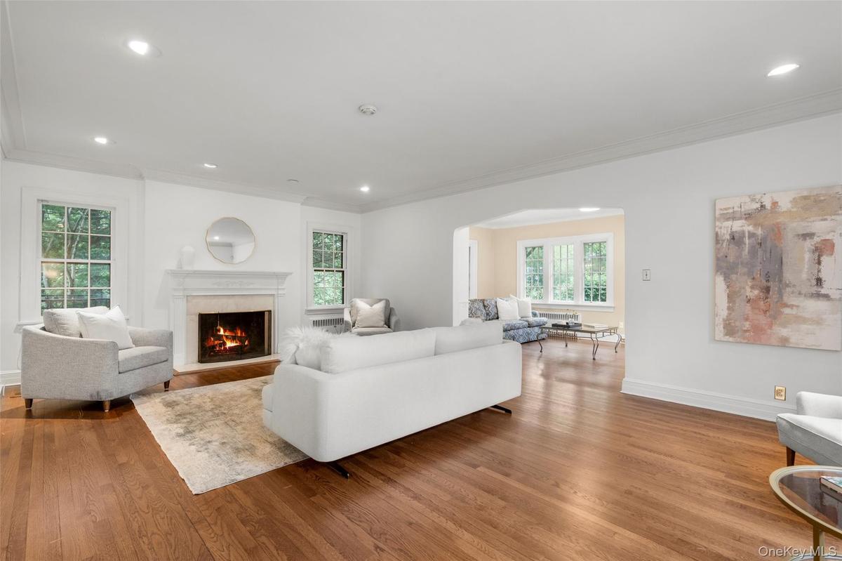 Bright living room with wood-burning fireplace