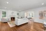 Bright living room with wood-burning fireplace