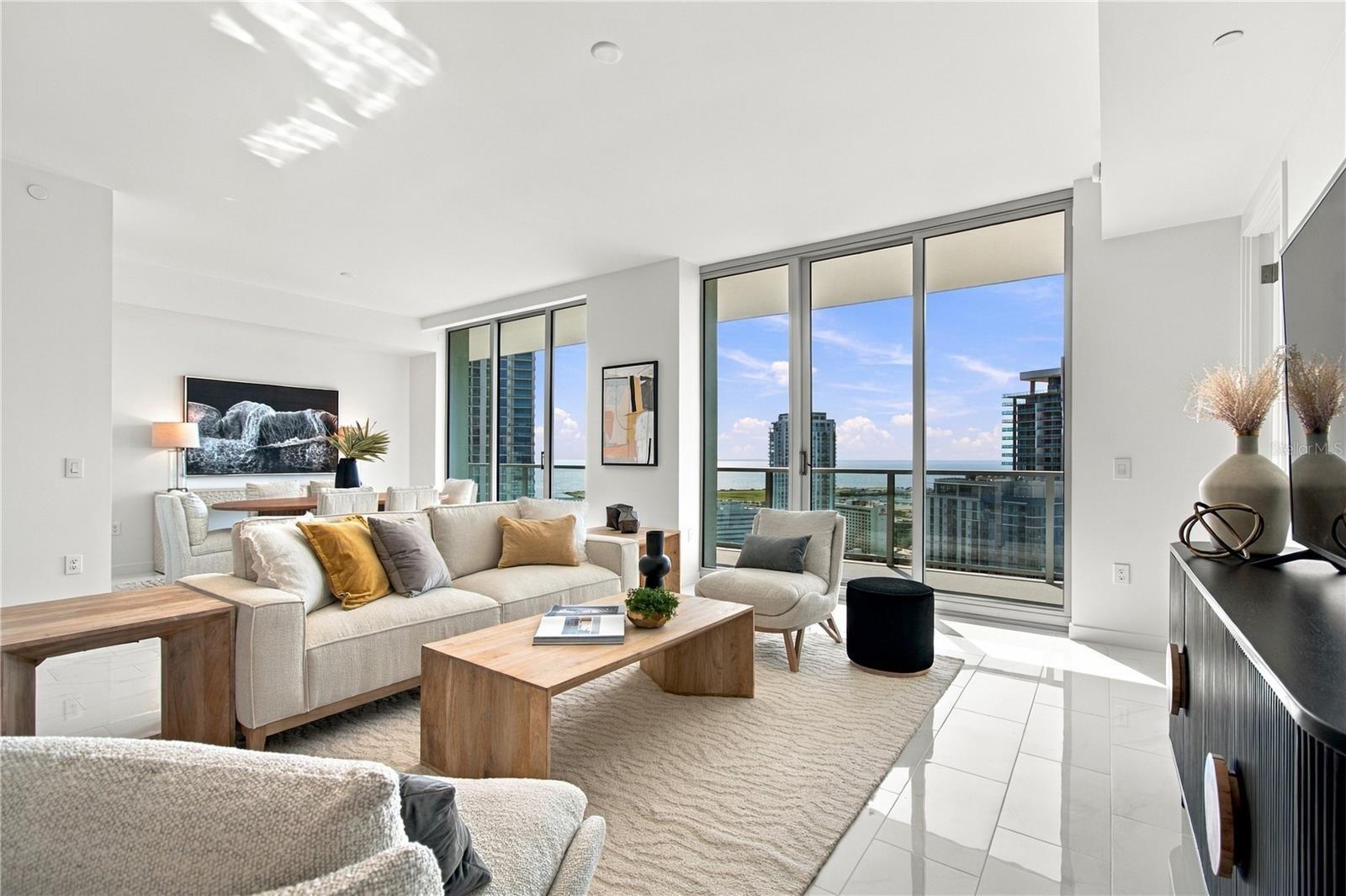 Professionally staged 28-foot great room showcases the exceptional scale and versatility of Residence 2505