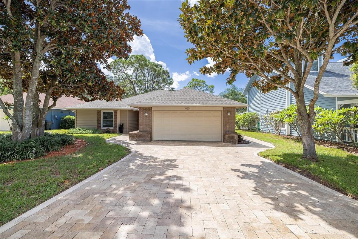 Beautiful travertine driveway and walkways. New roof 2022.