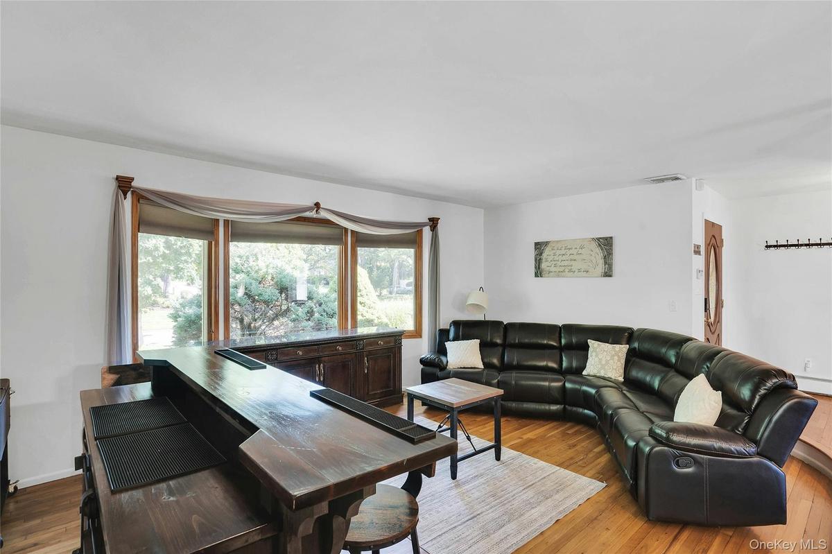 Sunken living room with a lot of natural light.