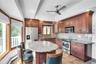 Updated kitchen with wood cabinets.