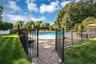 Pool has is surrounded by executive fencing.