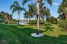 Lush grassy area outside your back door is ideal for pets or friends to gather.