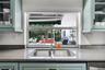 Sleek kitchen featuring quartz countertops and updated cabinetry