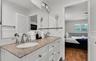 Elegant bathroom with dual vanity and granite countertops