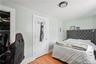 Spacious bedroom featuring hardwood floors, generous closet space, and plenty of room for comfortable living.