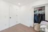 Versatile bonus room featuring modern flooring, recessed lighting, and generous closet space. 2nd Floor. 2nd Floor Unit
