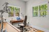 Bright home office with large windows and greenery views — ideal remote-work setup in Miami Beach.