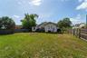 The backyard is enormous - and a blank slate. The alley sits behind the fence at the rear of the property. You could easily add a garage with an ADU, 