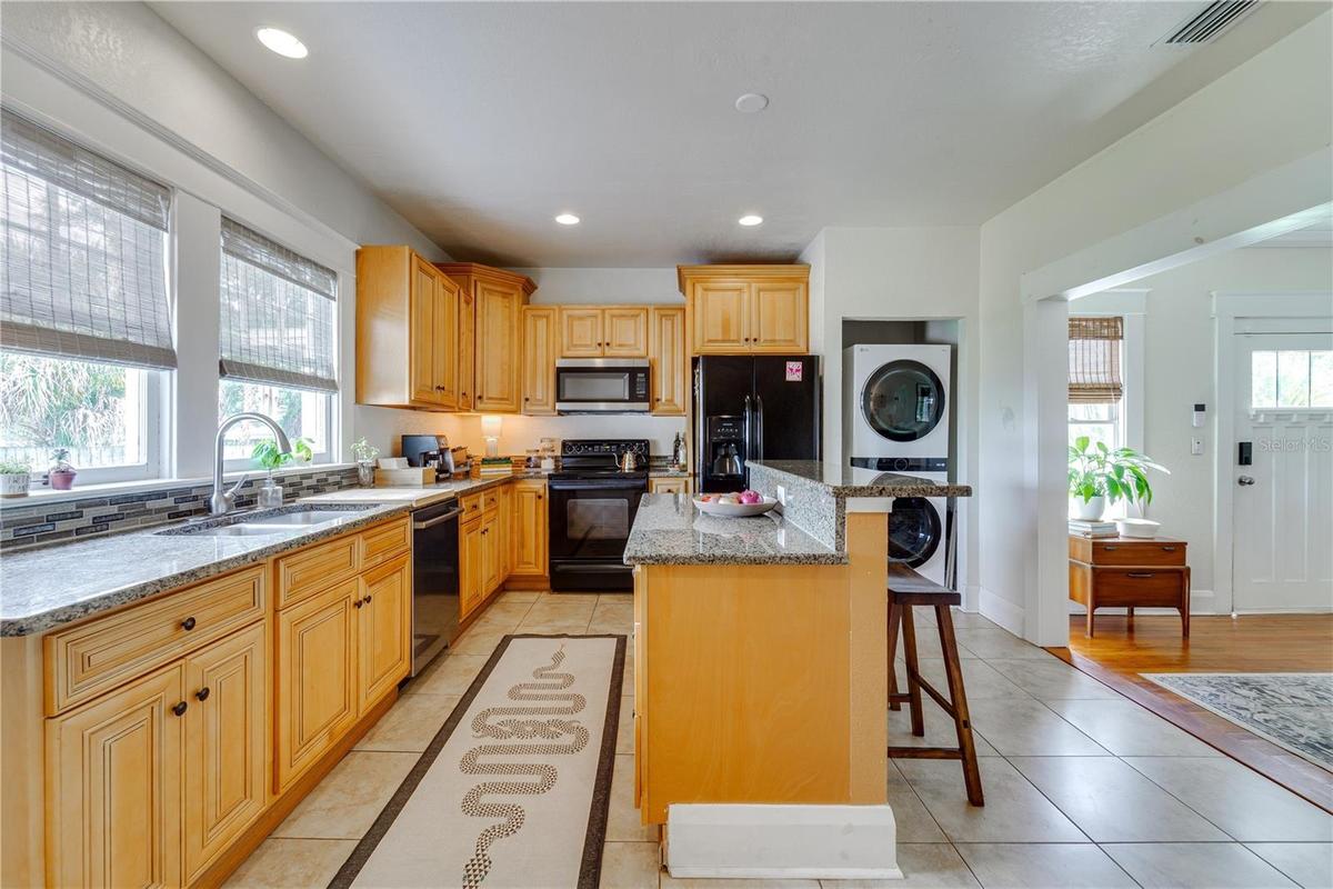 The kitchen was renovated in 2013, along with both bathrooms, and updated plumbing & electrical throughout. The kitchen overlooks the backyard & is sp