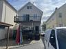 rear of home with 2 decks