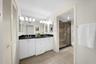Primary Bathroom with Dual Sinks and Walk-In Shower